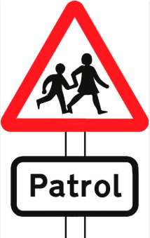 School crossing patrol ahead (some signs have amber lights which flash when crossings are in use)
